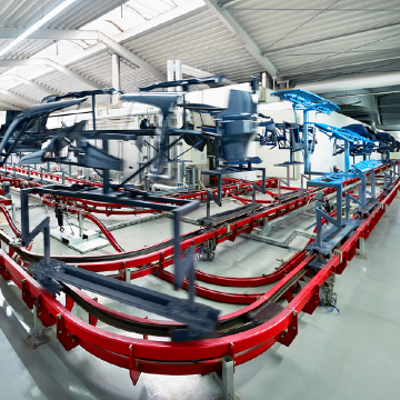 CALDAN Conveyor floor conveyor system in action with parts handling in a long production line